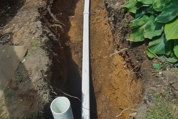 Excavated line repair in progress